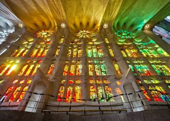 Stained glass rising with golden light shining through